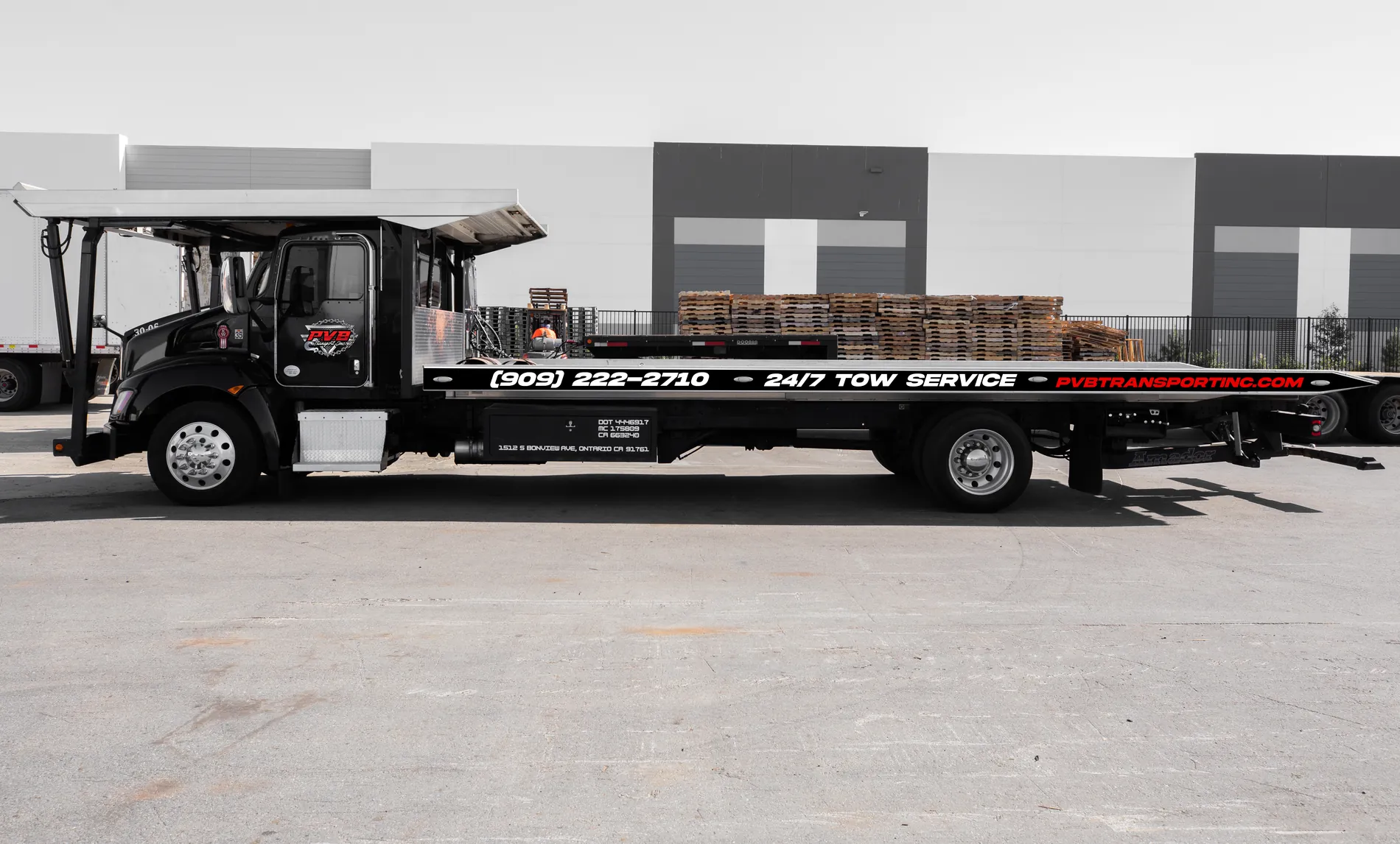PVB Transport flatbed tow truck ready for an emergency towing call