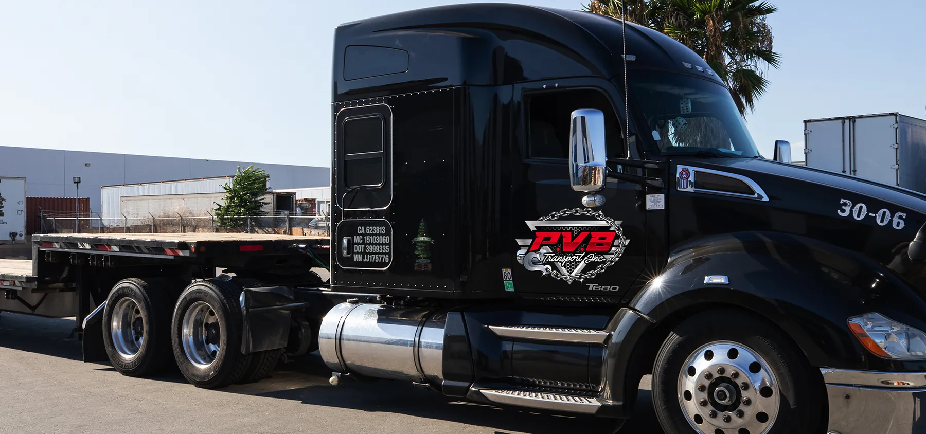 PVB Transport Kenworth T680 tractor and flatbed trailer used for point-to-point vehicle transport